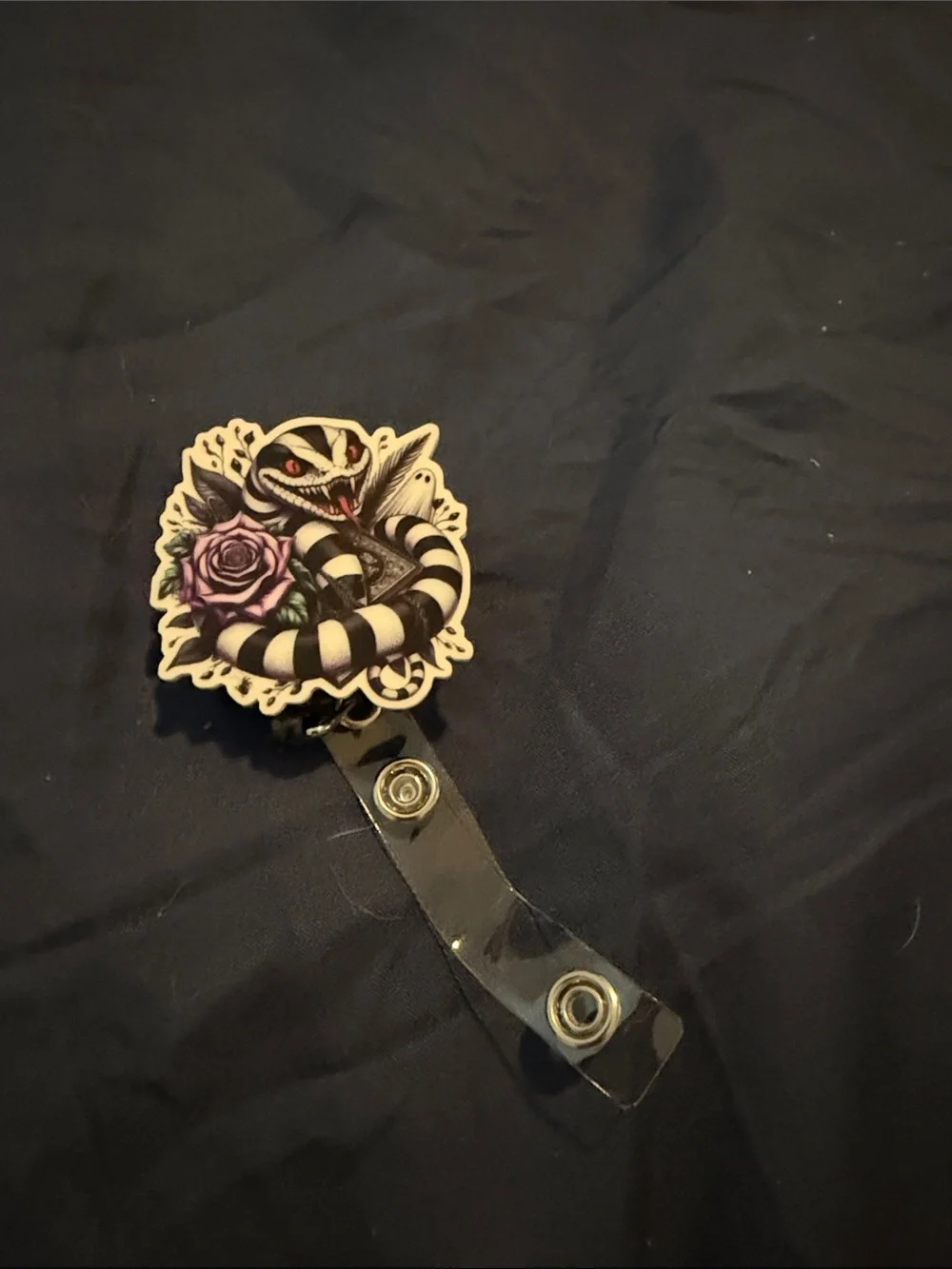 Black & White Snake Badge Reel with Purple Rose